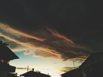 Low angle view of building against cloudy sky