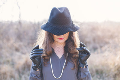 Close-up of beautiful woman against sky