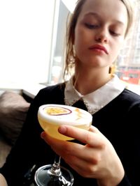 Young woman holding coffee cup