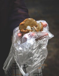 Close-up of hand holding ice cream