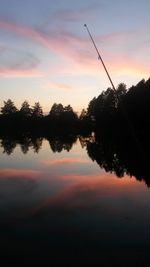 Scenic view of lake against romantic sky at sunset