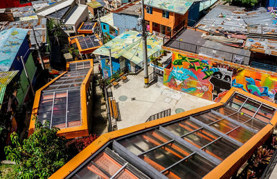 High angle view of railroad tracks amidst buildings in city