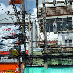 Low angle view of buildings and bridge in city