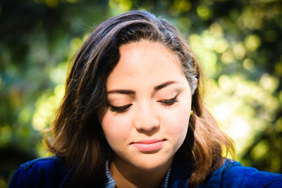 Close-up of young woman at park