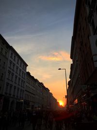 Buildings in city at sunset