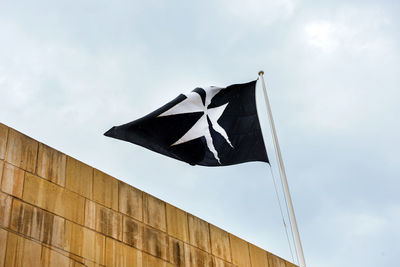 Low angle view of flag against sky