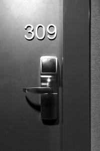 Close-up of electric lamp on door