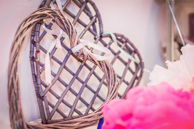 Close-up of pink wicker basket on table