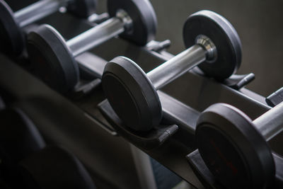 Dumbbells in the gym at sports club for exercise and bodybuilding.