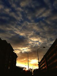 Low angle view of silhouette trees against sky at sunset