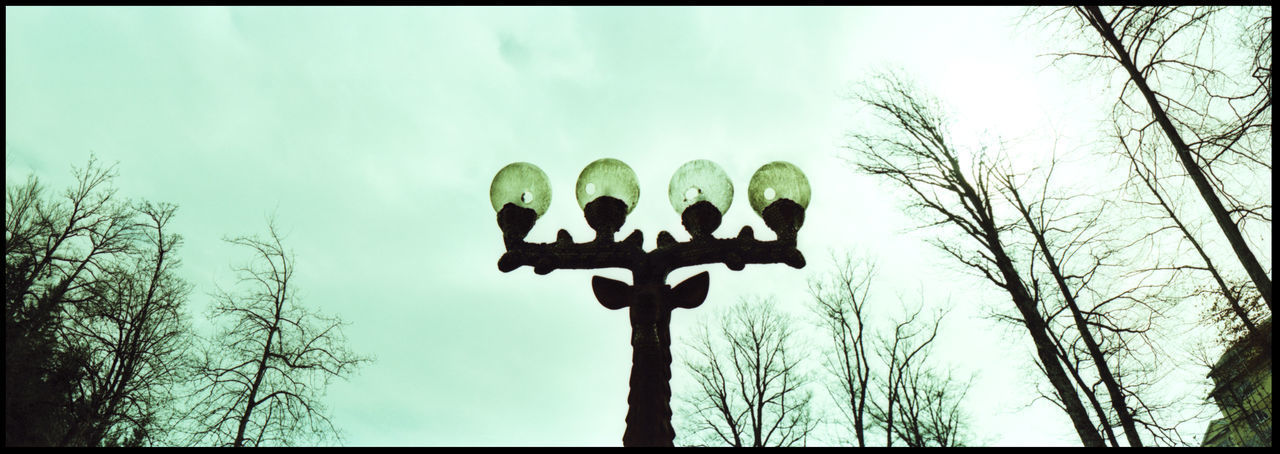 LOW ANGLE VIEW OF SILHOUETTE MAN AGAINST SKY