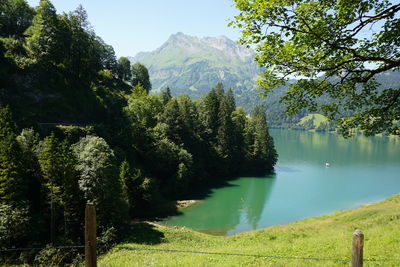 Scenic view of lake and mountains against sky