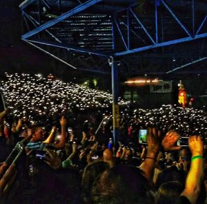 Illuminated ferris wheel at night