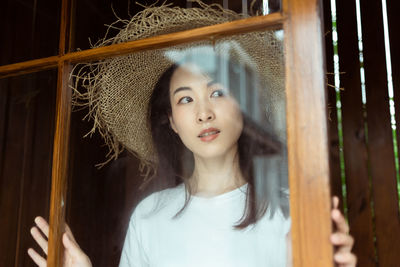 Portrait of young woman looking away