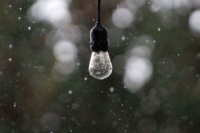 High angle view of raindrops on snow