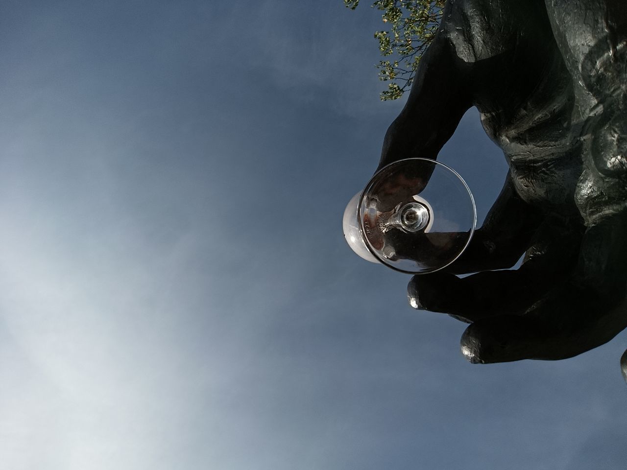 sky, blue, light, low angle view, cloud, nature, one person, copy space, hand, day, outdoors