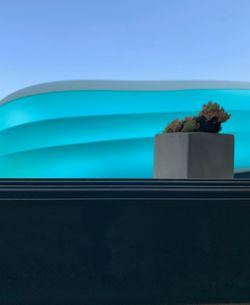 Swimming pool against clear blue sky