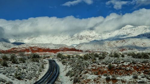 Close-up of car on landscape against sky