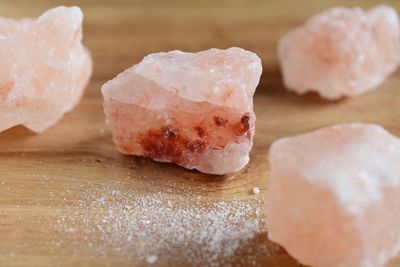 Close-up of rock salt on table