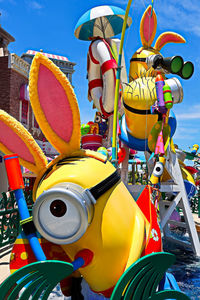 Close-up of amusement park ride against sky