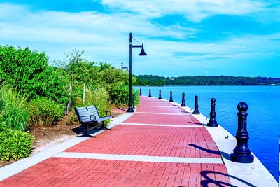 Empty jetty leading to calm sea