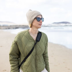 Young woman standing at beach