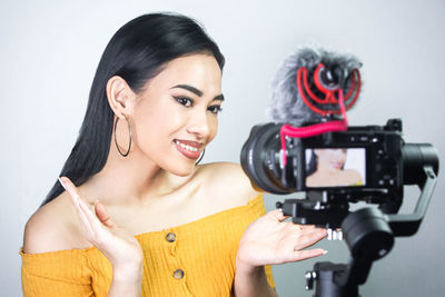 Portrait of woman photographing