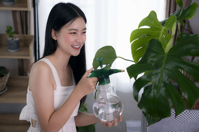 Woman holding a plant