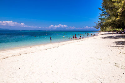 Scenic view of beach against blue sky