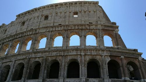 Low angle view of historical building against blue sky