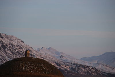 Scenic view of snowcapped mountains against sky