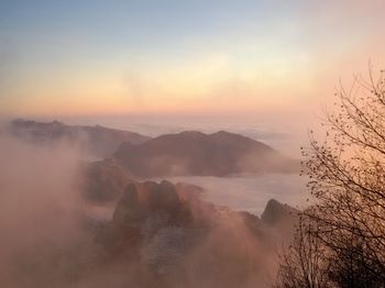 Scenic view of mountains against sky during sunset