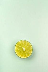 Close-up of lemon slices on white background