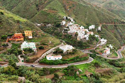 Narrow road along countryside landscape