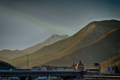 View of buildings against mountain range