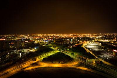 High angle view of illuminated cityscape at night