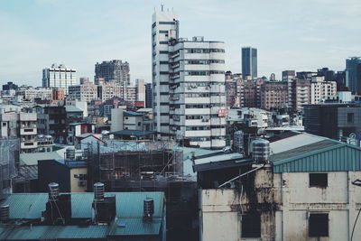 Buildings in city against sky