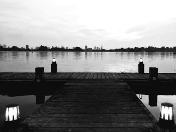 Pier over river against sky