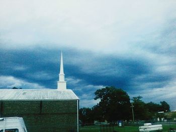 View of tower against cloudy sky