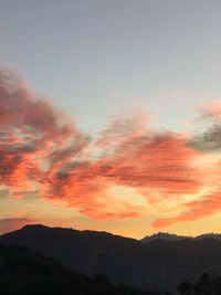 Low angle view of silhouette mountains against sky during sunset