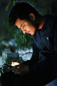 Young man using mobile phone