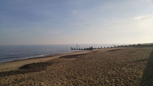 Scenic view of beach and sea against sky 