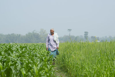 Full length of man standing on field