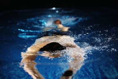 Man swimming in pool