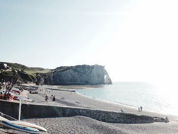 Scenic view of beach against clear sky on sunny day