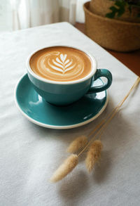 Close-up of cappuccino on table