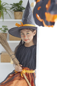 Portrait of cute girl in traditional clothing during halloween