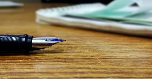 Close-up of fountain pen on table