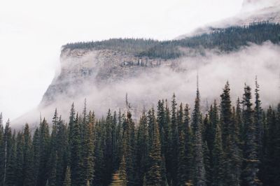 Scenic view of mountains against cloudy sky