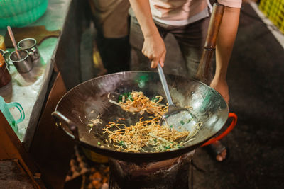 Midsection of man preparing food